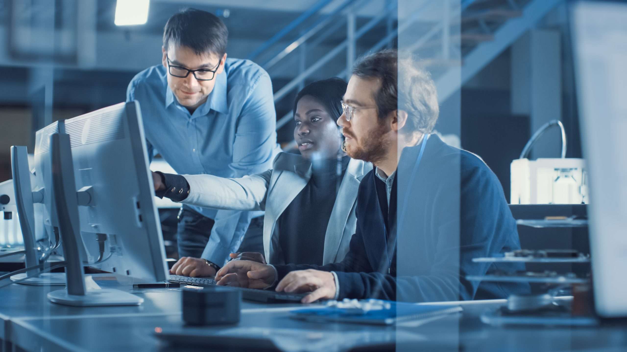 Electronics Development Engineer Working on Computer, Talks with